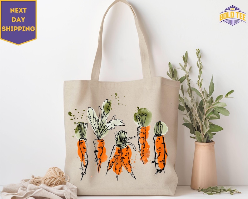 a tote bag with carrots on it next to a potted plant