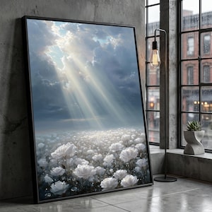 May include: A framed art print depicts a field of white flowers under a dramatic sky. Sunlight streams through the clouds, illuminating the flowers. The artwork is displayed in a room with a window and a modern floor lamp.