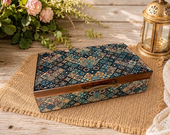 May include: A rectangular wooden box featuring a hinged lid and a front metal latch. The exterior surfaces are decorated with a repeating pattern of small, multicolored diamond-shaped tiles in shades of blue, teal, brown, and cream.