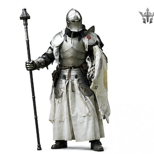 May include: A full suit of medieval armor, including a helmet, chest plate, and leg protection. The armor is silver-colored with black accents and is worn over a white tunic. The knight holds a long staff and a shield with a gold emblem.