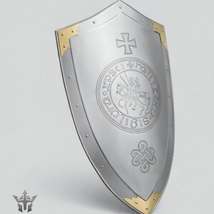 May include: A silver shield with a gold trim and rivets. The shield features a cross at the top and a circular emblem with a knight on horseback. A decorative knot design is at the bottom.