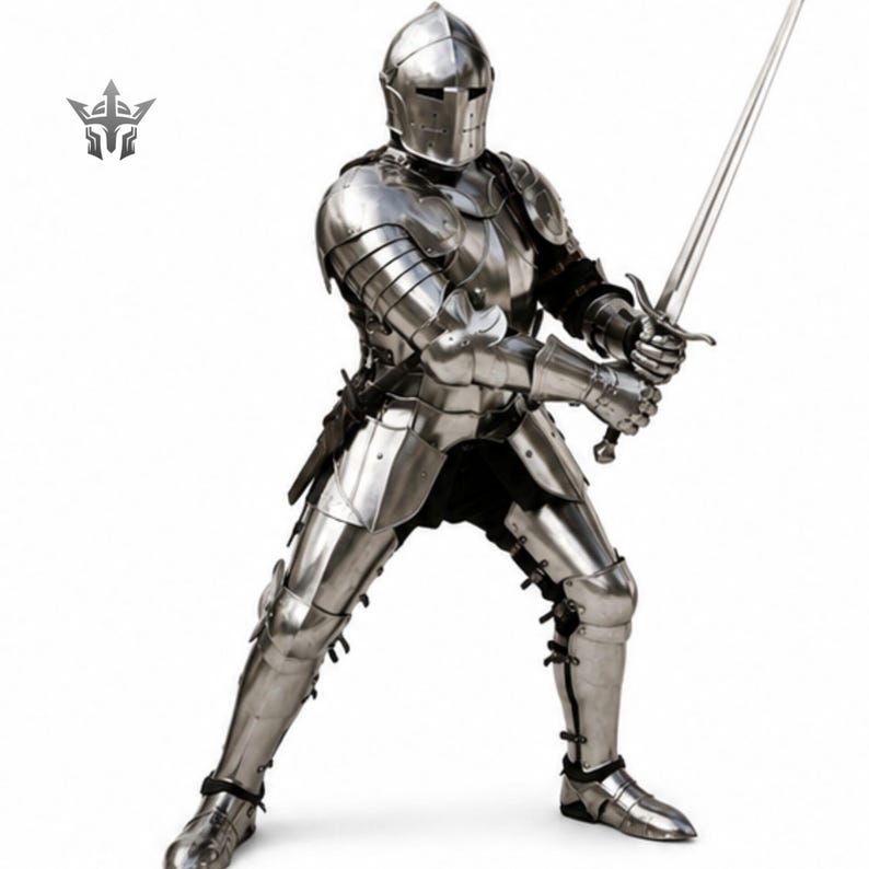 May include: A full suit of polished silver-colored steel plate armor featuring a closed helmet with a horizontal visor slit, articulated pauldrons, gauntlets, and greaves. The armor is posed in a defensive stance, holding a long steel sword.