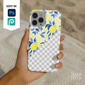 May include: A phone case featuring a watercolor design of lemons and blue leaves on a white background. The case is held in a hand, with the lower half of the case showing a transparent checkered pattern. The text "EDIT IN" and "Sugar Press Studio" are visible.