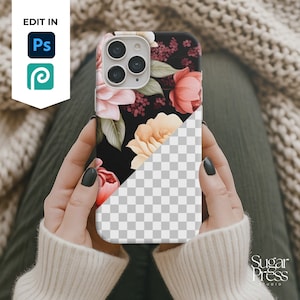 May include: A floral phone case featuring a black background with pink, peach, and yellow flowers. The case has a diagonal split, with the bottom half showing a transparent, checkered pattern. The phone case is held in a person's hands.