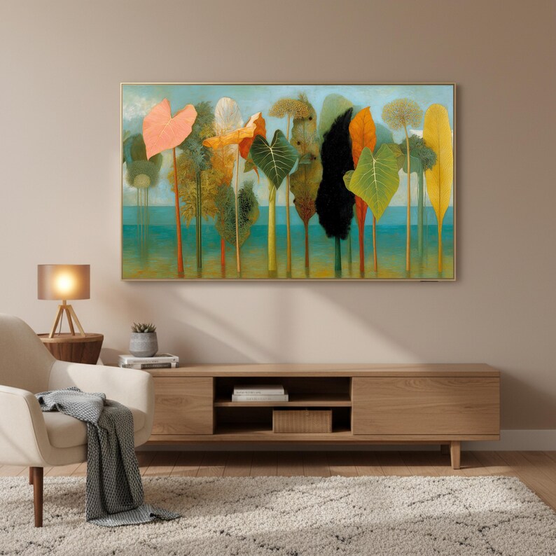 May include: A framed art print depicting a stylized landscape with colorful trees and foliage. The artwork features a variety of hues, including orange, green, yellow, and black, set against a light blue background. The print is displayed above a wooden media console.