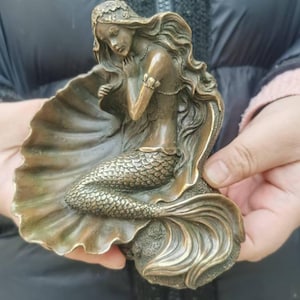 copper mermaid statue