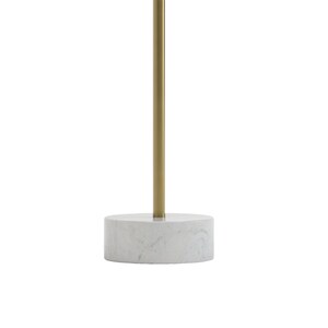 May include: A round marble table with a gold metal base. The table is white with gray veining and the base is a cylinder shape.