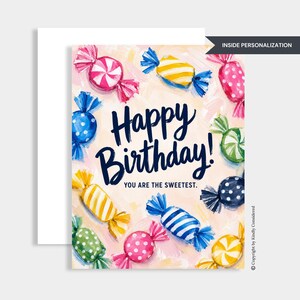 May include: A greeting card featuring a painted illustration of colorful wrapped candies on a light background. The text reads Happy Birthday! YOU ARE THE SWEETEST. The candies are depicted in various patterns including polka dots and stripes in pink, blue, yellow, and green.