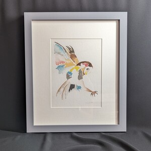 Owl in flight print mounted in a grey frame