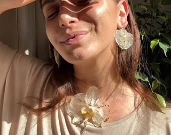 Compra Orecchini a bottone con fiore e tessuto all'ingrosso