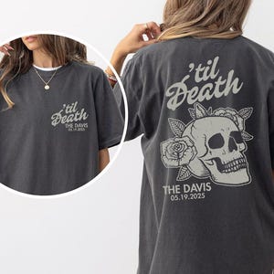 May include: Dark gray t-shirt with the text "'til Death" and a skull graphic with roses. The back of the shirt features the text "THE DAVIS 05.19.2025". The shirt is a short-sleeved, casual style.