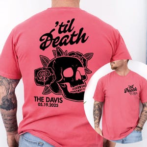 May include: Coral-colored t-shirt featuring a black skull design with roses and the text "'til Death" and "THE DAVIS 05.19.2025". The shirt has short sleeves and a crew neck.