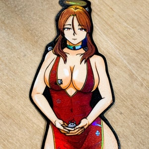 May include: A woman in a red dress with a halo above her head is holding a small gray creature in her hands. The dress has a floral pattern and a high slit. The woman has long brown hair and blue eyes.