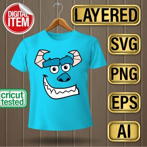 May include: A blue t-shirt with a cartoon monster face on it. The monster has one blue eye, one white eye, a blue nose, and a wide, toothy grin. The t-shirt is on a hanger and there are gold labels with the words "LAYERED", "SVG", "PNG", "EPS", and "AI" on the right side of the image.