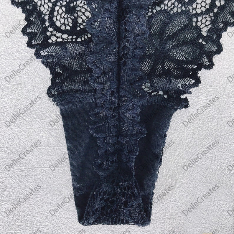 May include: Black lace underwear with a delicate floral pattern.