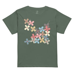 May include: A dark green t-shirt with a colorful floral design. The flowers are in shades of pink, blue, yellow, and green. The design is centered on the front of the shirt.