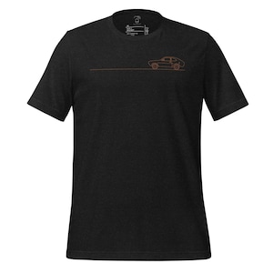 May include: A black t-shirt with a simple line drawing of a car in orange on the front.