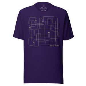 May include: A purple t-shirt with a graphic design of a maze with the text "01" repeated throughout the design. The text "Hello World!" is printed below the maze.