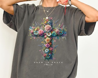 May include: A gray oversized t-shirt with a floral cross design and the text "Grow in Grace 2 Peter 3:18".