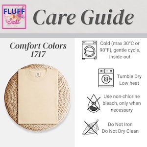 May include: A cream-colored Comfort Colors 1717 t-shirt on a woven mat. The image includes a care guide with washing instructions: cold water, gentle cycle, tumble dry low, non-chlorine bleach, and no ironing or dry cleaning. The Fluff & Sass logo is in the upper left corner.