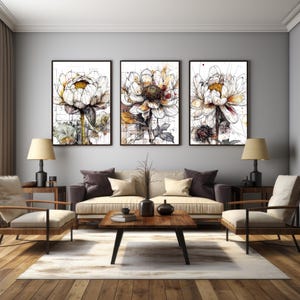 May include: Three framed watercolor paintings of white flowers with brown and black accents. The paintings are arranged in a row on a gray wall.