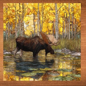 May include: An artistic depiction of a moose standing in a pond, drinking water. The moose is brown with large antlers. The background features a forest with yellow and gold leaves, reflecting in the water. The artwork is framed in a wooden border.