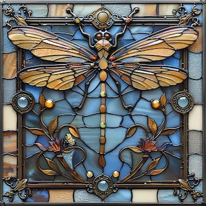 May include: A square stained glass panel featuring a central dragonfly with amber-toned wings and a segmented body. The background consists of blue glass panes with decorative metal filigree, floral motifs, and small circular glass accents.