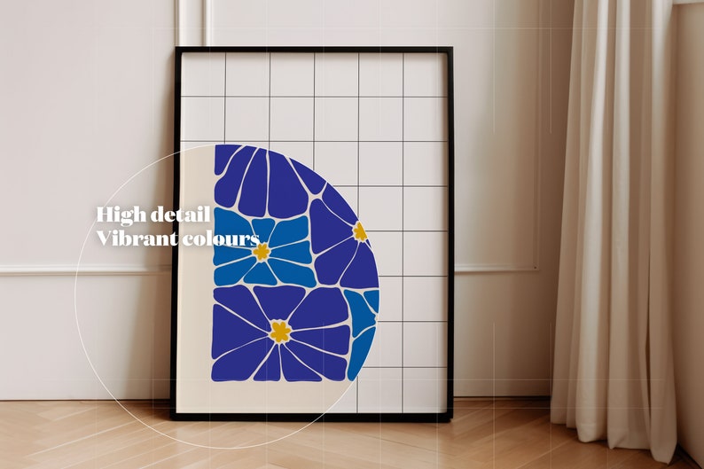 May include: A framed print with a geometric design of blue and yellow flowers on a white background. The print is framed in black and has a white grid pattern behind the image.