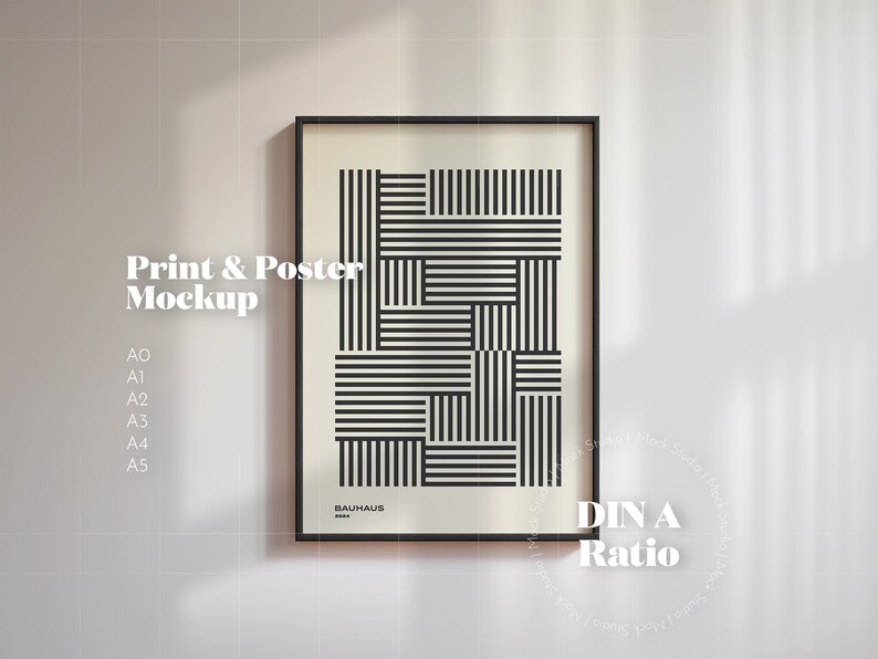 May include: A black framed poster mockup with a geometric black and white design. The poster is labeled "Bauhaus" and "DIN A Ratio".