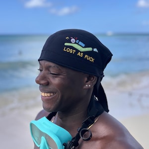 Black beanie featuring a scuba diver
