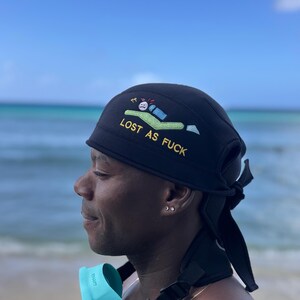 Black beanie featuring a scuba diver