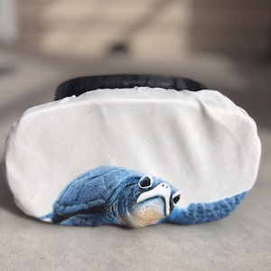 SCUBA dive mask cover with a baby turtle. Protects your scuba mask strap