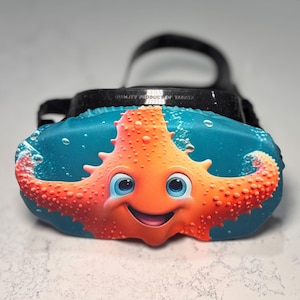 SCUBA dive mask cover featuring a starfish. Protect your scuba mask with this cute ocean themed scuba mask cover.