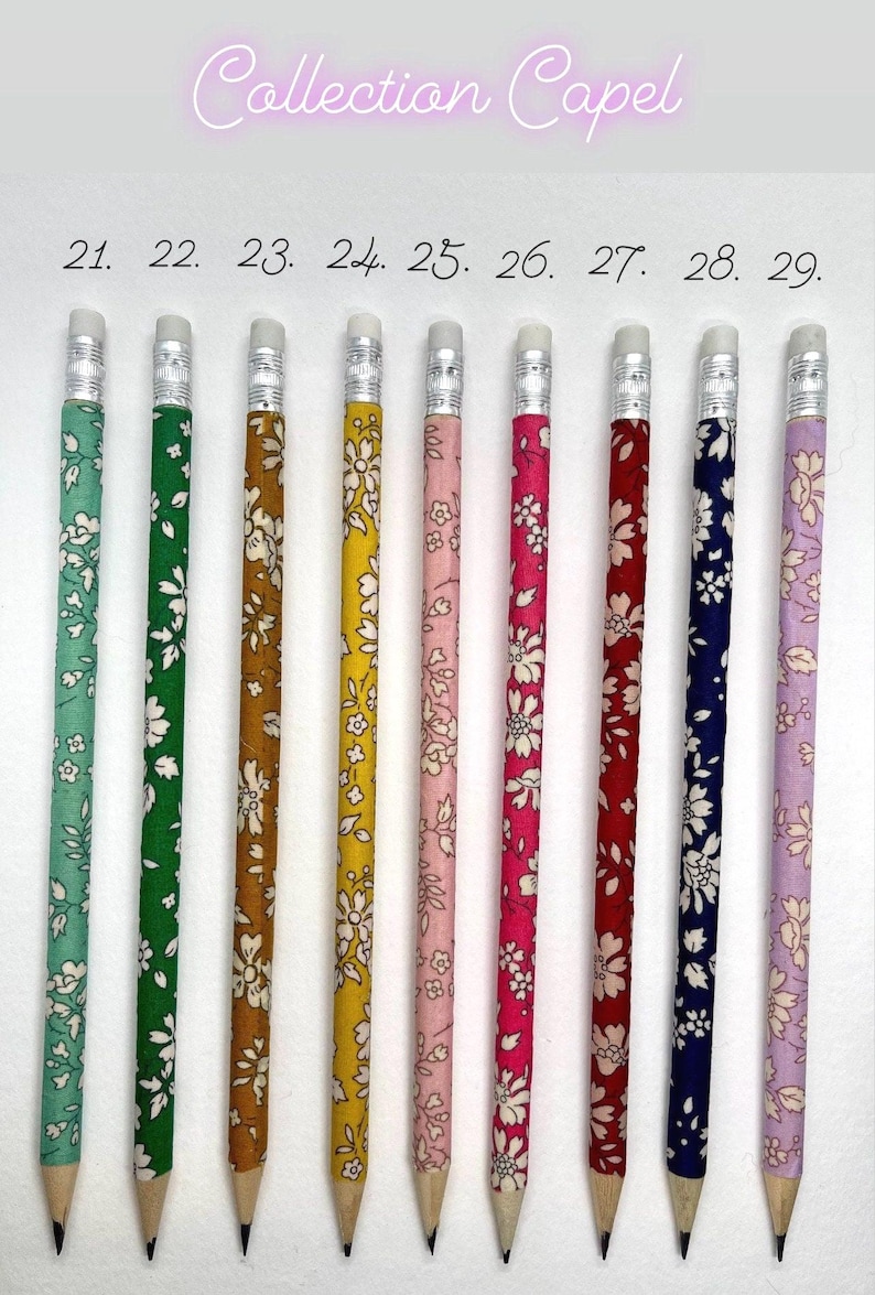 May include: Nine pencils with different floral patterns. The pencils are numbered 21 through 29. The pencils are all the same size and have a silver eraser.