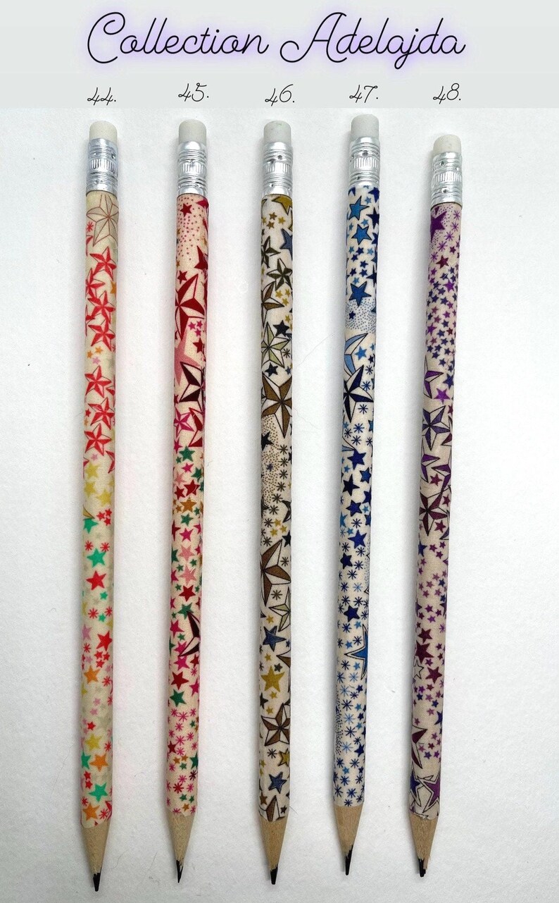 May include: Five wooden pencils with different star patterns. The pencils are labeled 44, 45, 46, 47, and 48. The pencils have a white background with colorful stars.