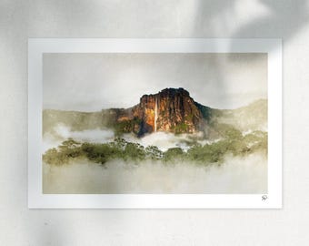 May include: A landscape print featuring a tall, dark mountain cliff with a thin waterfall cascading down its center. The base of the mountain is surrounded by dense green forest and thick white clouds, with a small signature in the bottom right corner.