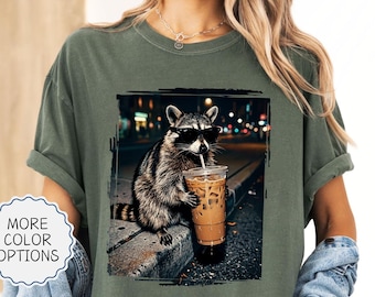 Comfort Colors® Funny Raccoon Drinking Iced Coffee Shirt: Animal Meme Graphic Tee