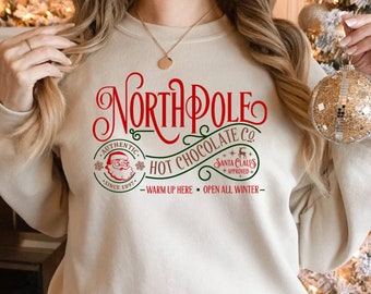 Sudadera del Polo Norte, camiseta navideña del Polo Norte, camiseta navideña, camiseta de Papá Noel, camiseta de reno, camiseta de chocolate caliente, regalo de Navidad, Papá Noel