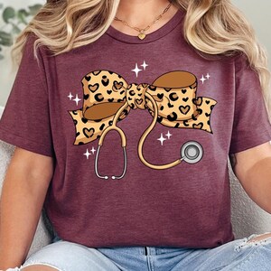 Coquette Nurse Stethoscope Bow Shirt, Christmas Gift for Nurse, Nurse Bow Shirt, Coquette Nurse Shirt, Nurse Gift,Leopard Nurse Ribbon Shirt