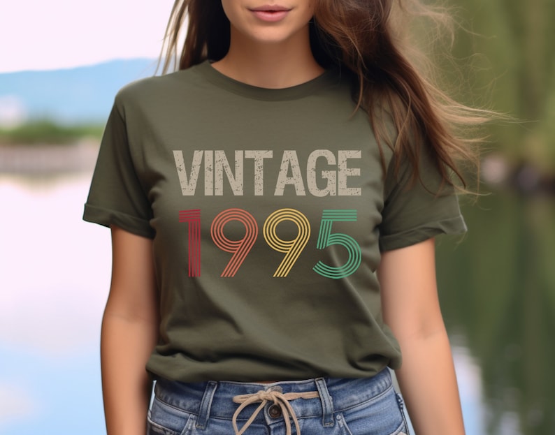 May include: A green t-shirt with the text "Vintage 1995" in a retro font with red, yellow, and green stripes.