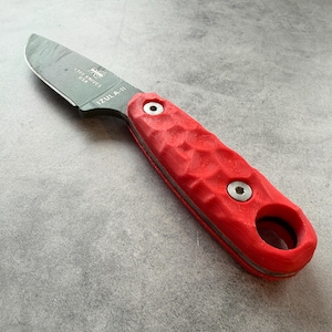 May include: A set of three ceramic mugs with a speckled, matte finish. The mugs are in shades of cream, light gray, and dark gray. Each mug has a simple, minimalist design, perfect for coffee or tea.