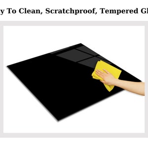 May include: A black tempered glass surface being cleaned with a yellow microfiber cloth. Easy to clean, scratchproof, tempered glass.