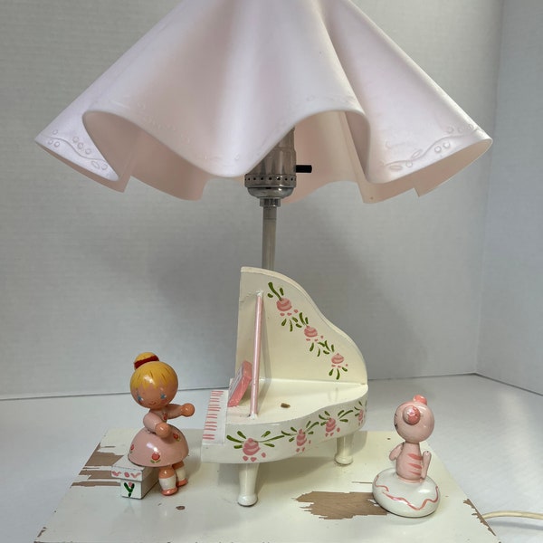 Antique pink children’s lamp and music box. Made of wood with plastic lamp shade. Darling!