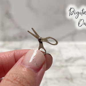 May include: A small, antique-style pair of scissors with a silver finish. The scissors are held between fingers, with the text "Digital File Only" in a script font in the background.