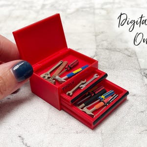 May include: A miniature red toolbox with an open lid and two extended drawers containing tiny assorted hand tools. The word "tools" is printed on the front of the middle drawer. The text "Digital File Only" is visible in the upper right corner.