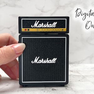 May include: A miniature black Marshall amplifier with white trim and the Marshall logo. The top section has a yellow stripe. The words "Digital File Only" are written in cursive.