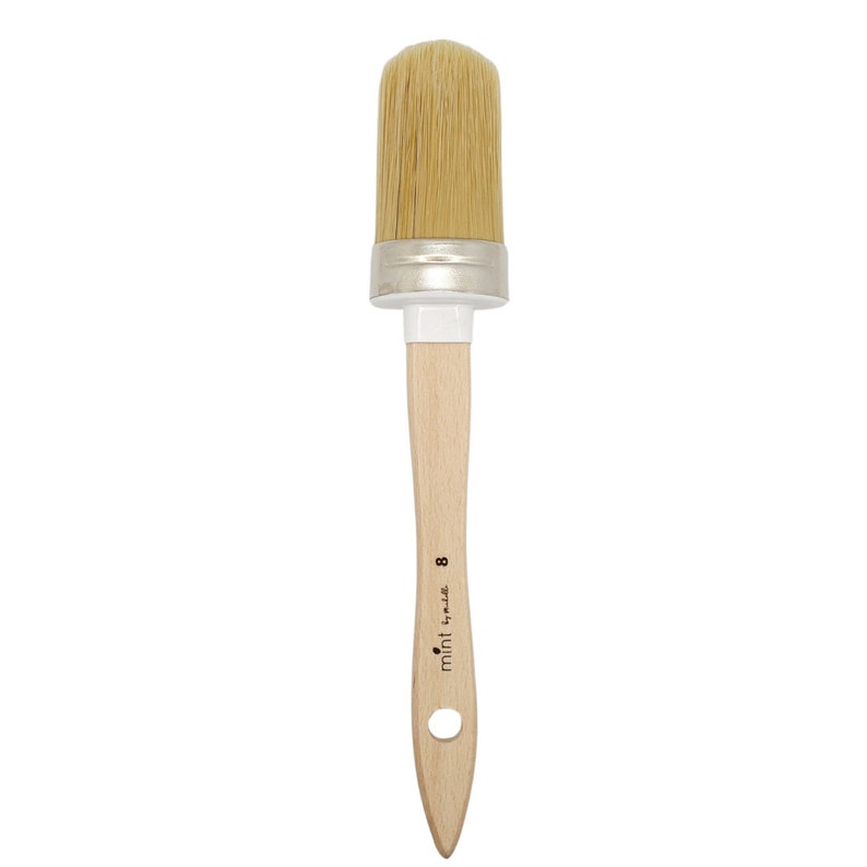 May include: A wooden-handled paint brush with natural bristles. The brush is labeled "mint by ml" and "8".