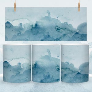 May include: Three white ceramic mugs with a blue watercolor design. The design features abstract shapes and swirls in shades of blue.