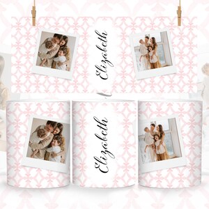 May include: Three white mugs with a pink and white geometric pattern. Each mug features a different photo of a family with three children. The name "Elizabeth" is written in cursive on two of the mugs.