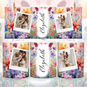 May include: A white mug with a watercolor floral design featuring purple, pink, orange, and yellow flowers. The mug has a photo of a family of three in a white frame with the name "Elizabeth" written in black cursive.